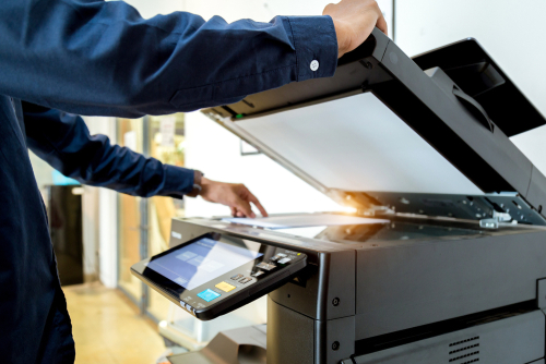 man copying on an industrial printer